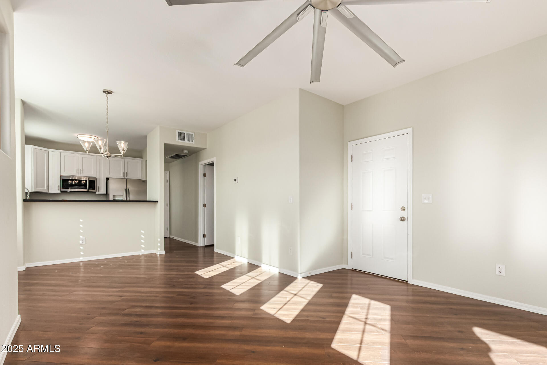 1720 East Thunderbird Road, Unit 2125 Phoenix, AZ 85022 - Photo 4 of 37 a view of a kitchen with wooden floor and a sink