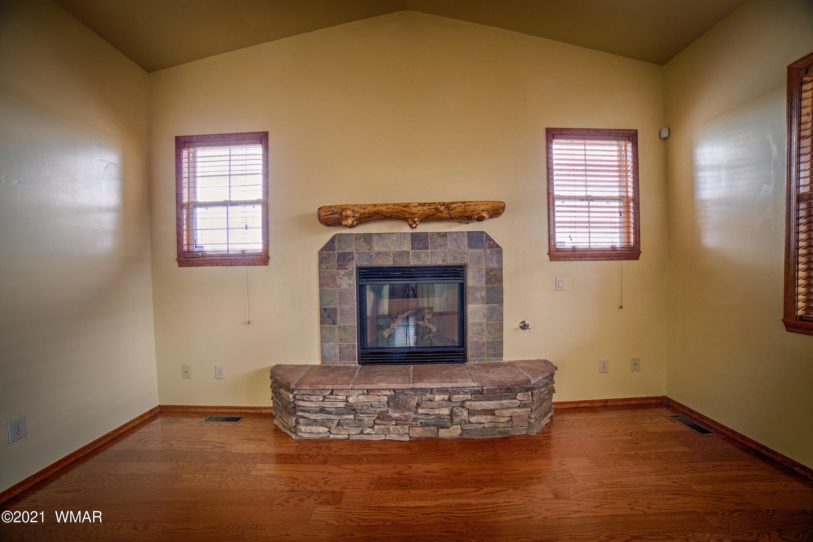 600 South Rock Ridge Drive Show Low, AZ 85901 - Photo 12 of 25 a living room with furniture and a fireplace