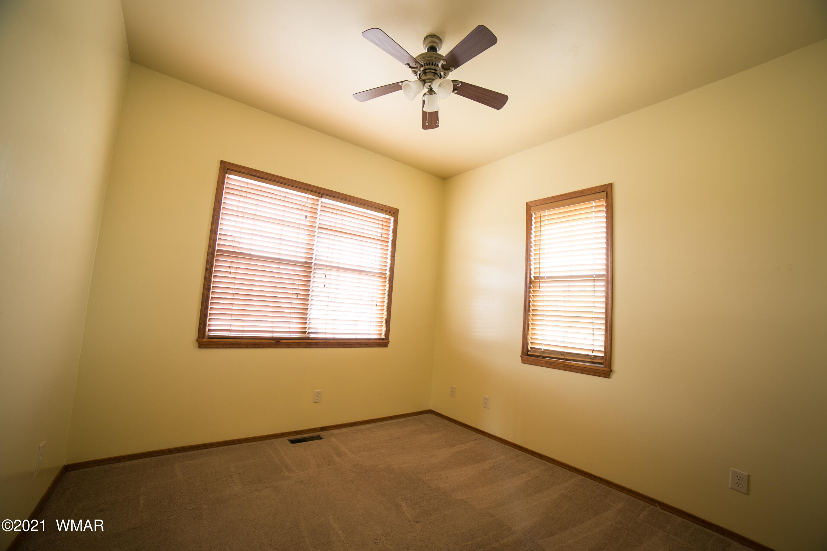 600 South Rock Ridge Drive Show Low, AZ 85901 - Photo 14 of 25 a view of an empty room with a window