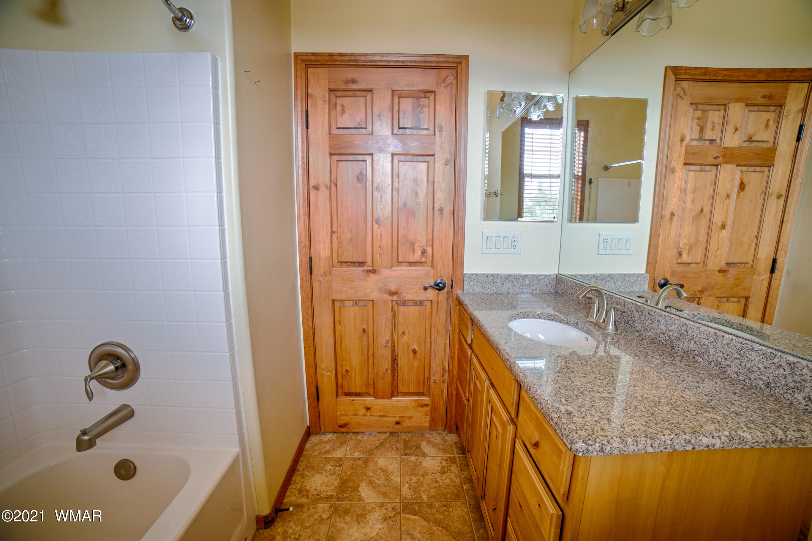 600 South Rock Ridge Drive Show Low, AZ 85901 - Photo 15 of 25 a bathroom with a granite countertop sink and a mirror
