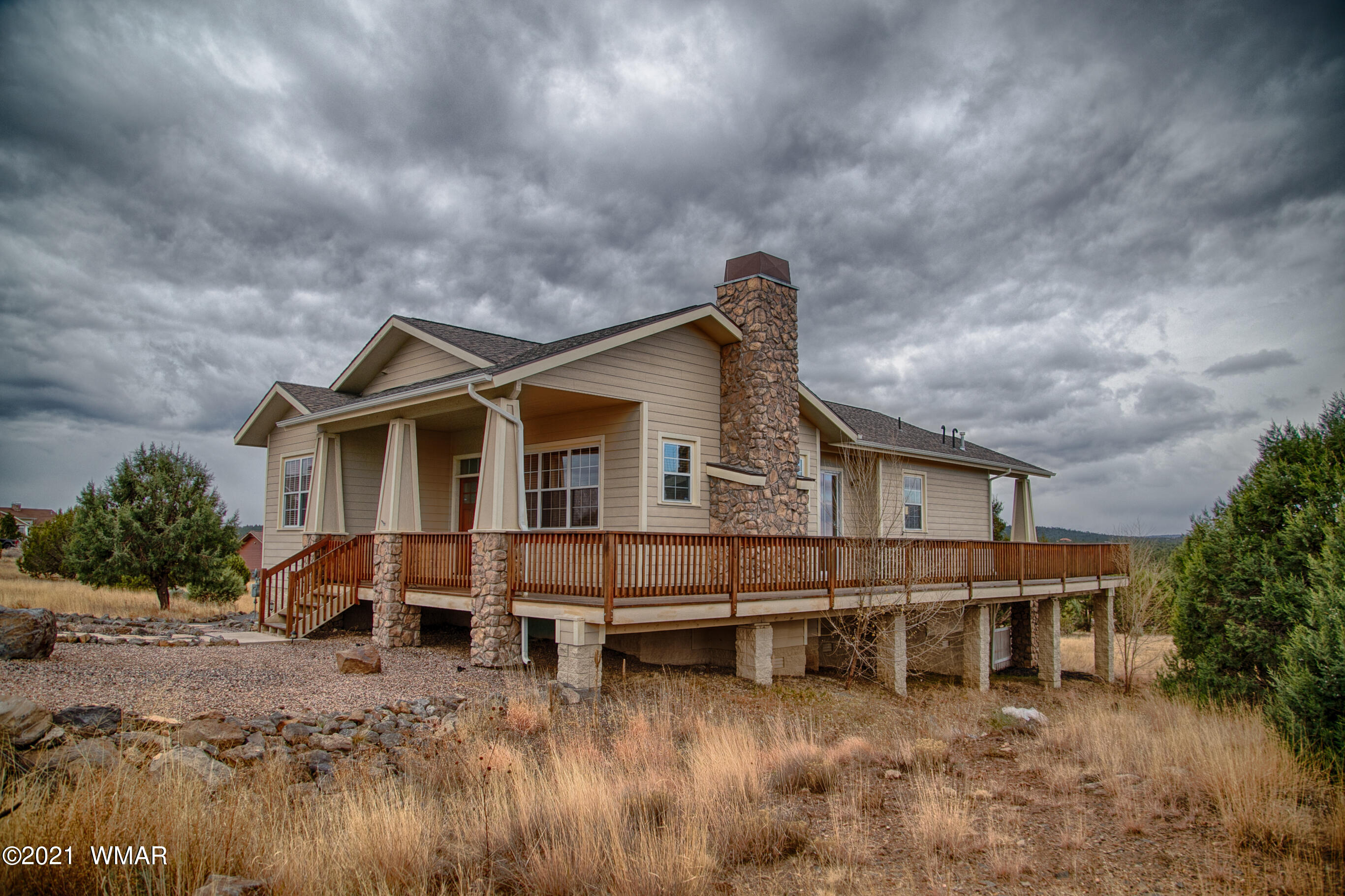600 South Rock Ridge Drive Show Low, AZ 85901 - Photo 3 of 25 a view of a house with wooden fence
