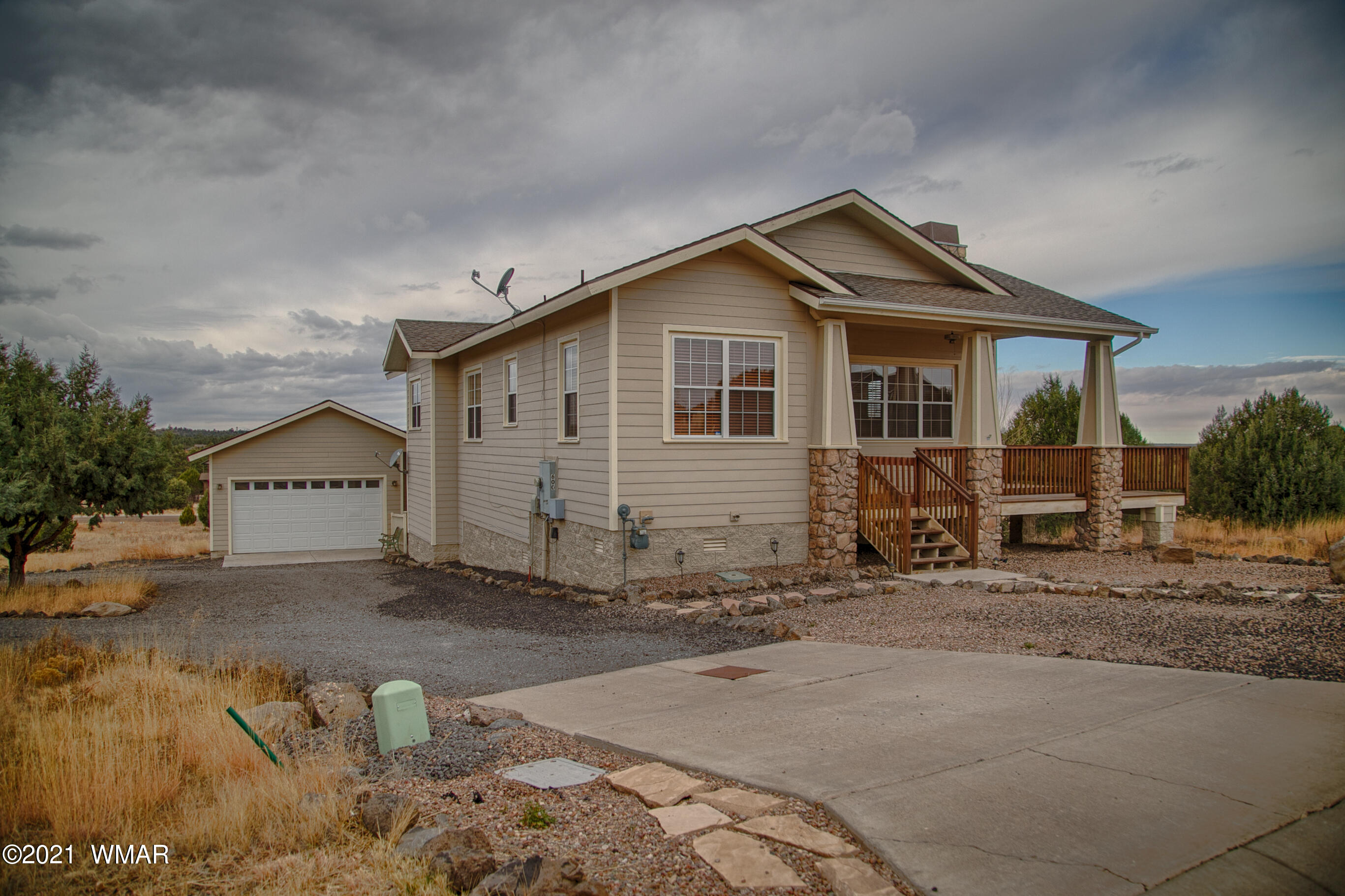 600 South Rock Ridge Drive Show Low, AZ 85901 - Photo 7 of 25 a view of a house with a yard