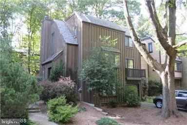 a view of a house with a yard and plants