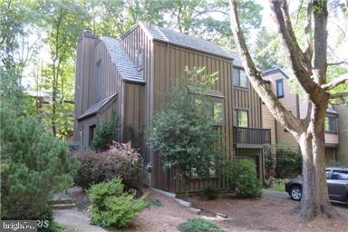 a view of a house with a yard and plants