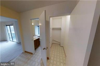 1543 Scandia Circle Reston, VA 20190 - Photo 11 of 30 a view of a hallway with wooden shelves