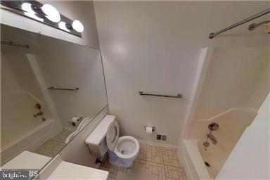 1543 Scandia Circle Reston, VA 20190 - Photo 18 of 30 a white toilet sitting next to a bath tub