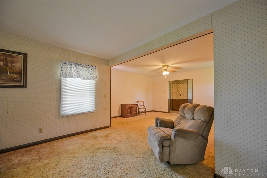 3057 Springfield Xenia Road Springfield, OH 45506 - Photo 9 of 37 This inviting living space features warm carpet and a window offering natural light.