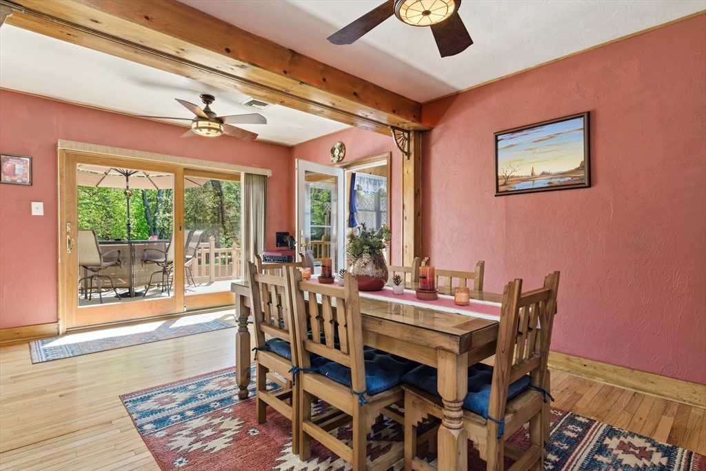 284 North Woodstock Road Southbridge, MA 01550 - Photo 11 of 42 a view of a dining room with furniture wooden floor and a chandelier