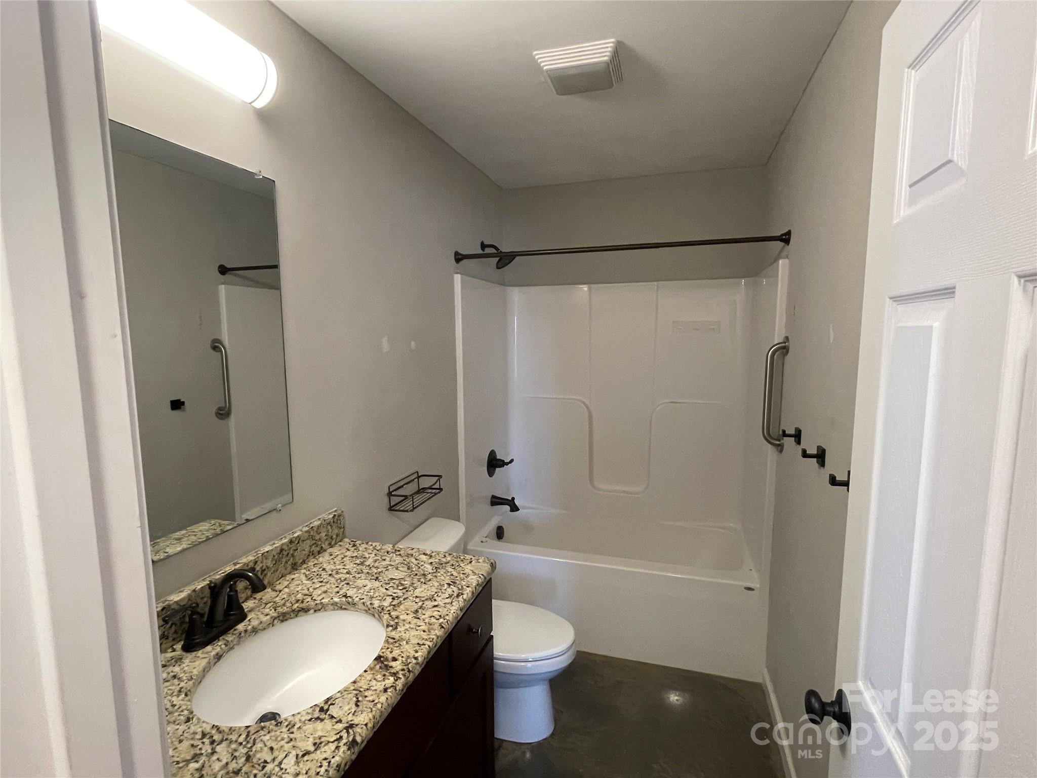 4421 Dillbrook Lane Denver, NC 28037 - Photo 8 of 10 a bathroom with a granite countertop sink toilet and shower