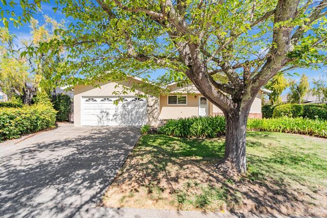 a pathway of a house with garden
