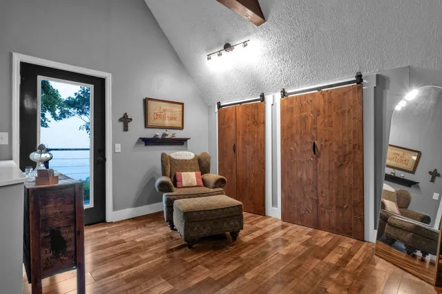 a bedroom with furniture and wooden floor