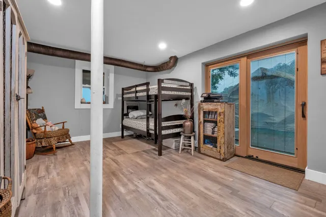 a view of a livingroom with furniture and staircase