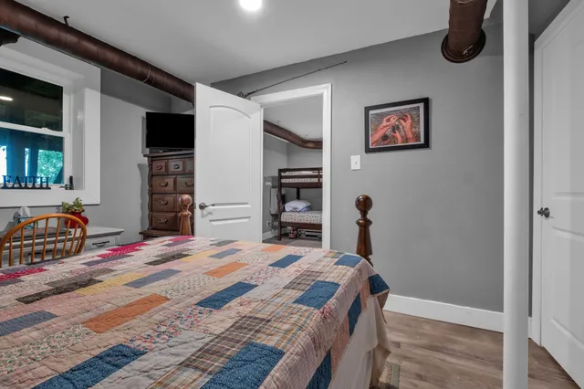 a bedroom with a bed and a closet