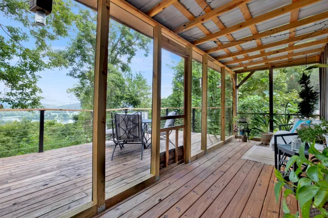 a porch with wooden floor in outdoor space