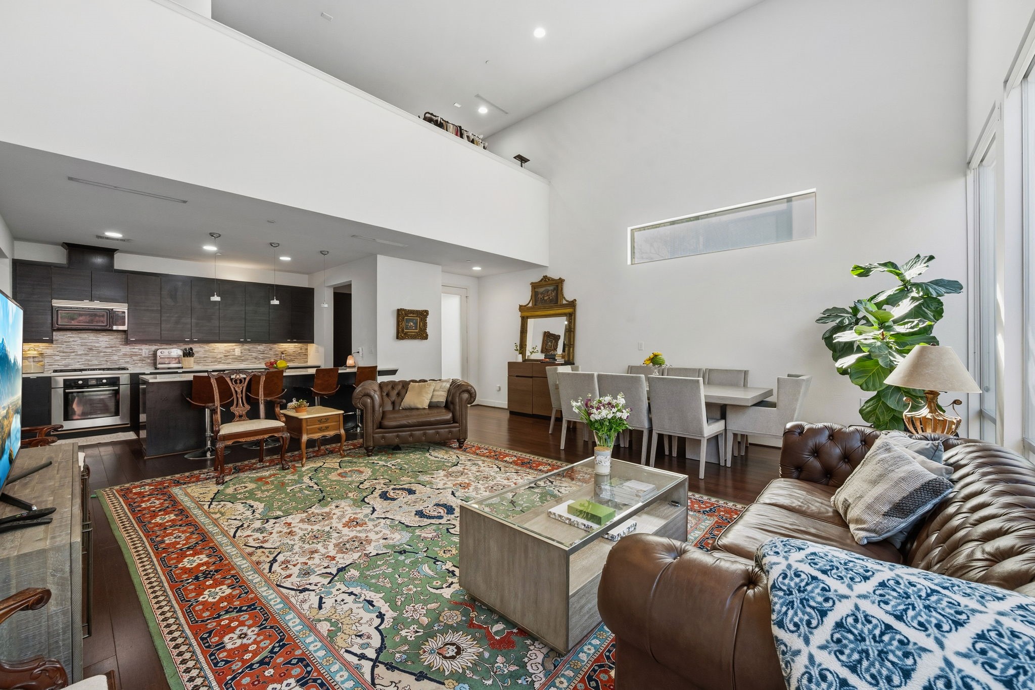 3302 Lake Street, Unit 3 Houston, TX 77098 - Photo 2 of 20 a living room with furniture kitchen view and a table