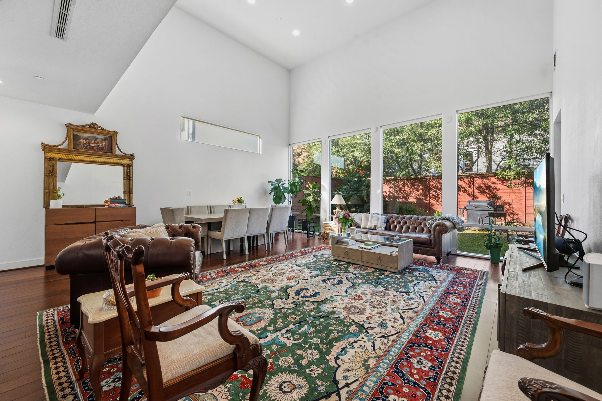 3302 Lake Street, Unit 3 Houston, TX 77098 - Photo 3 of 20 a living room with furniture and a floor to ceiling window