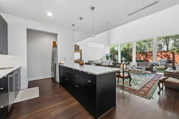 a kitchen with sink stove and cabinets
