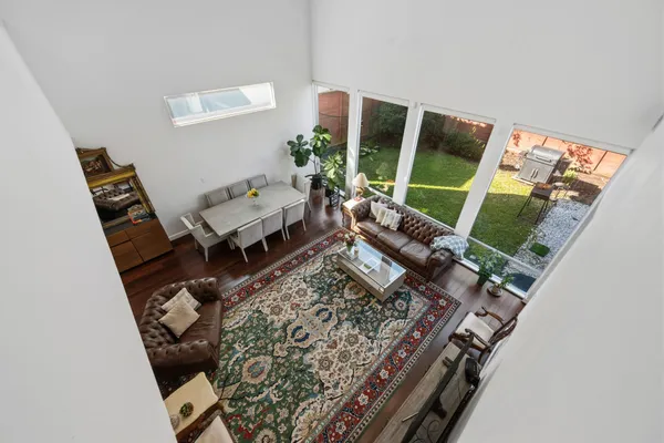 a living room with furniture and a rug