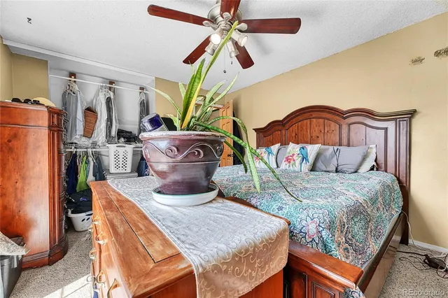 a bedroom with a bed dresser and a window