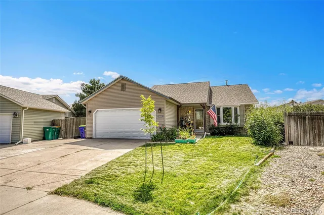 a kitchen with a table chairs stainless steel appliances and cabinets
