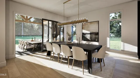 a living room with furniture chandelier and a table