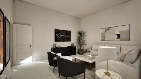 a living room with furniture a rug and a flat screen tv