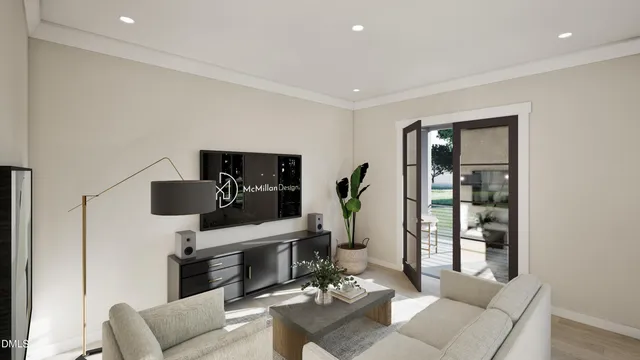 a living room with furniture and view of kitchen