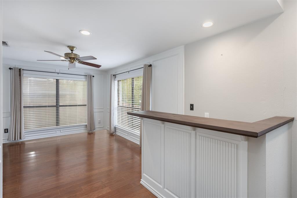68 Legend Road Benbrook, TX 76132 - Photo 16 of 34 Secondary living space with bar located between two living spaces for easy entertaining.