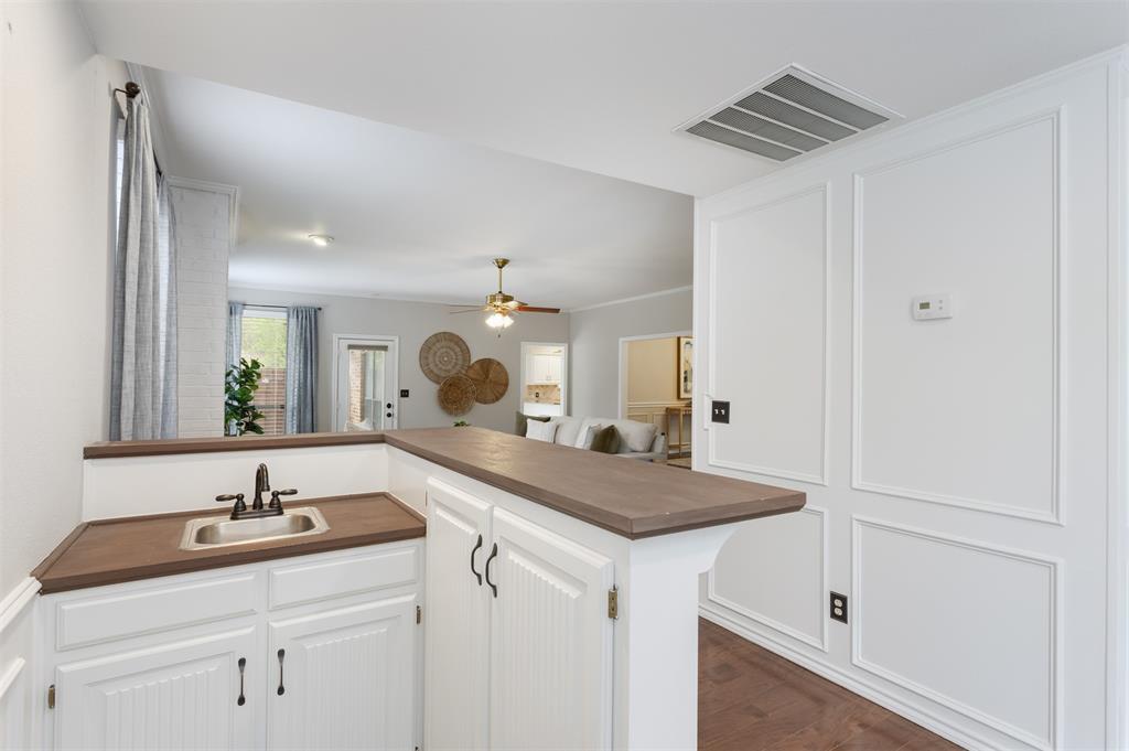 68 Legend Road Benbrook, TX 76132 - Photo 17 of 34 The wet bar, centered in the home, makes it easy to serve your guests.