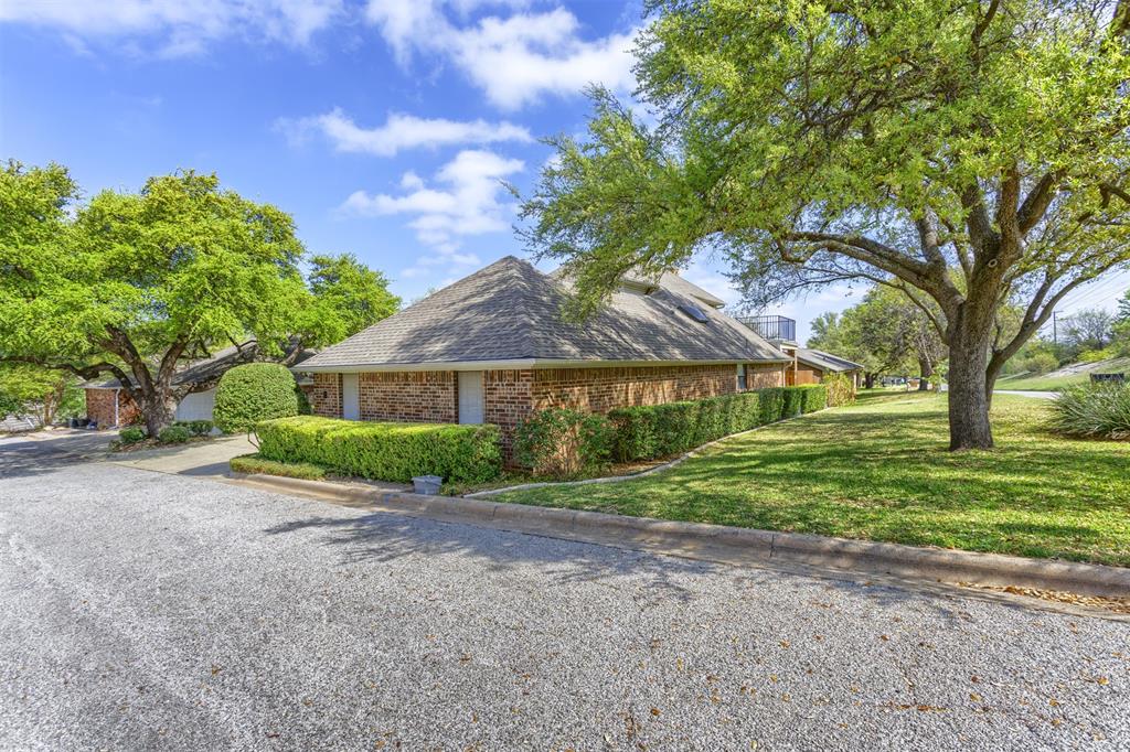 68 Legend Road Benbrook, TX 76132 - Photo 2 of 34 Corner lot on a cul de sac! The additional green space to the side of the home makes it feel like a large lot!