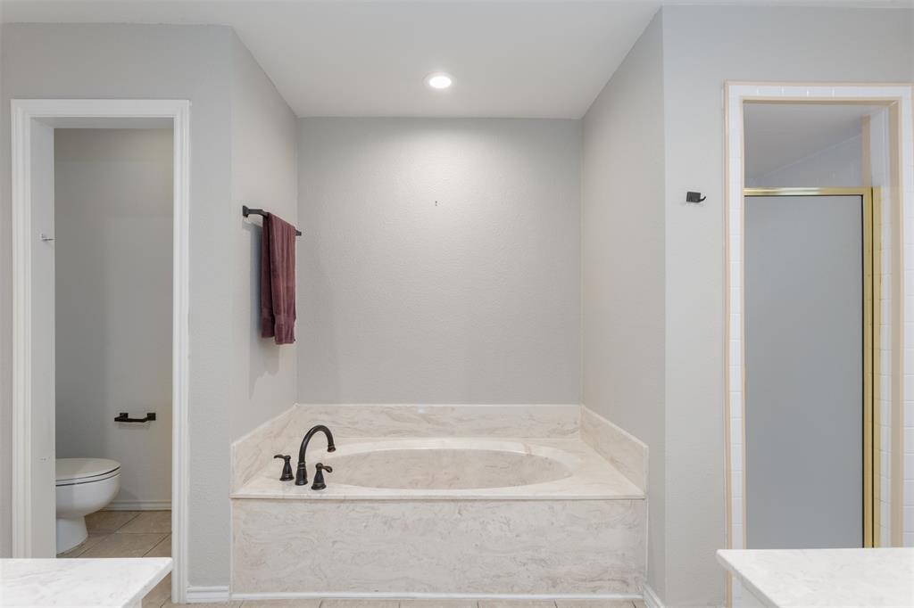 68 Legend Road Benbrook, TX 76132 - Photo 22 of 34 The primary bathroom has lots of possibilities! Change the shower to all glass and add a free-standing tub!