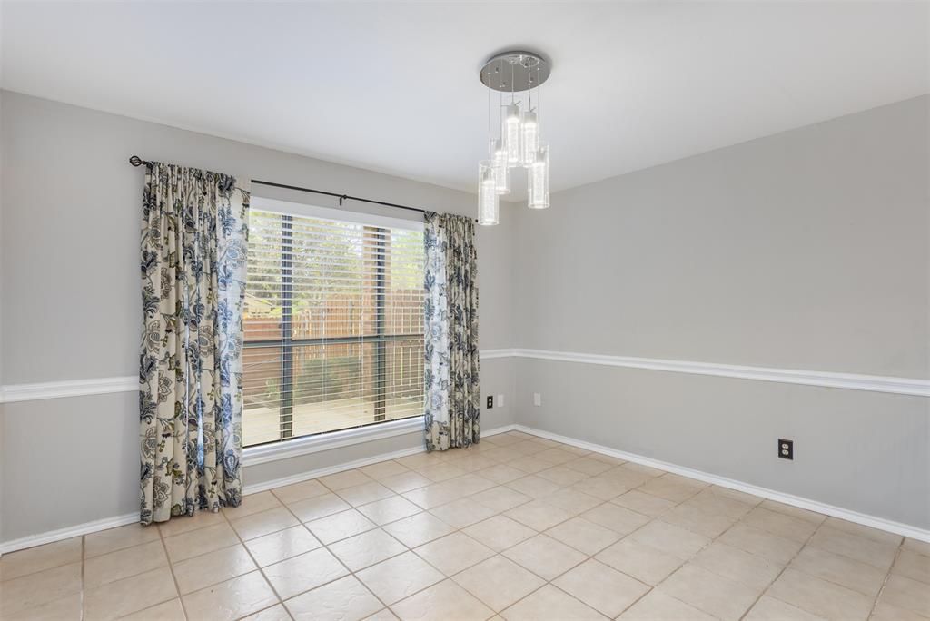 68 Legend Road Benbrook, TX 76132 - Photo 10 of 34 The breakfast room also has a view of the backyard.