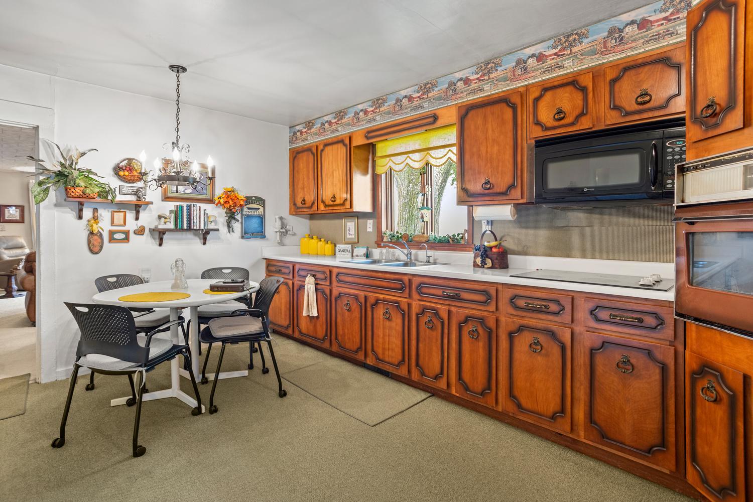 4520 North 600 East Road Sidell, IL 61876 - Photo 11 of 31 a kitchen that has a table and chairs in it