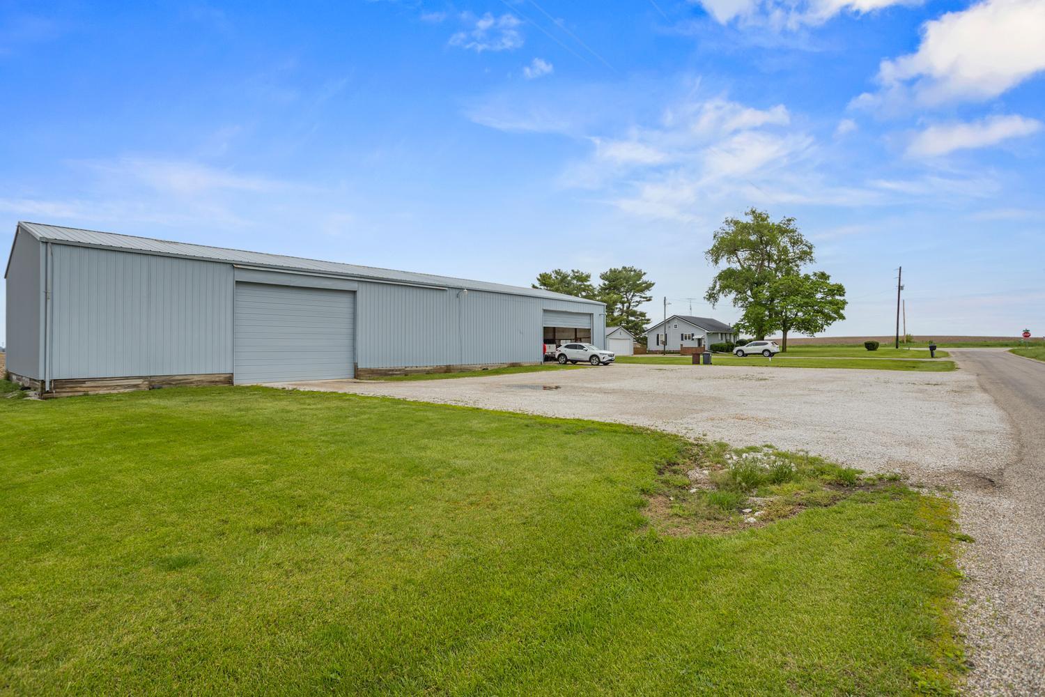 4520 North 600 East Road Sidell, IL 61876 - Photo 7 of 31 a front view of a house with a garden