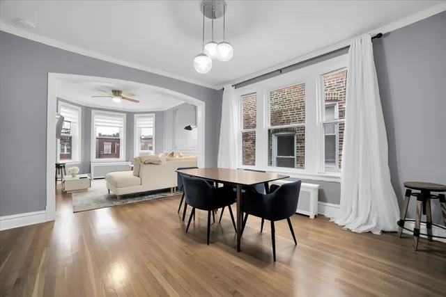 a view of a dining room with furniture window and wooden floor
