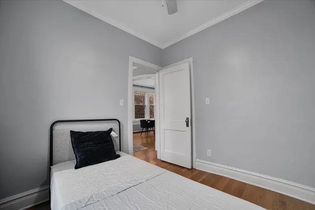 a bedroom with a bed and a mirror