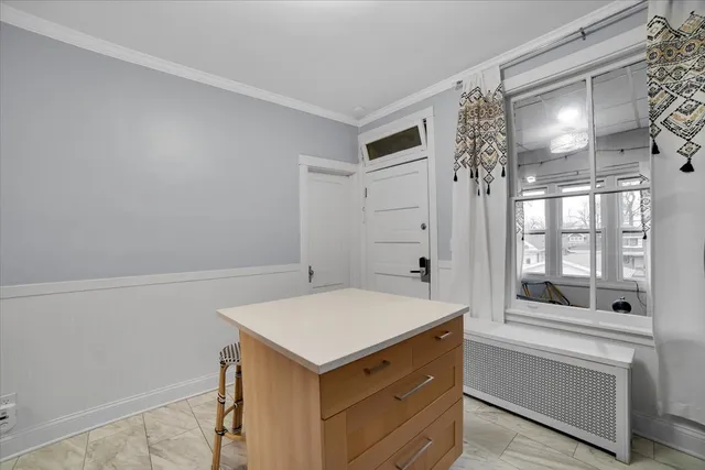 a bathroom with a tub and a window