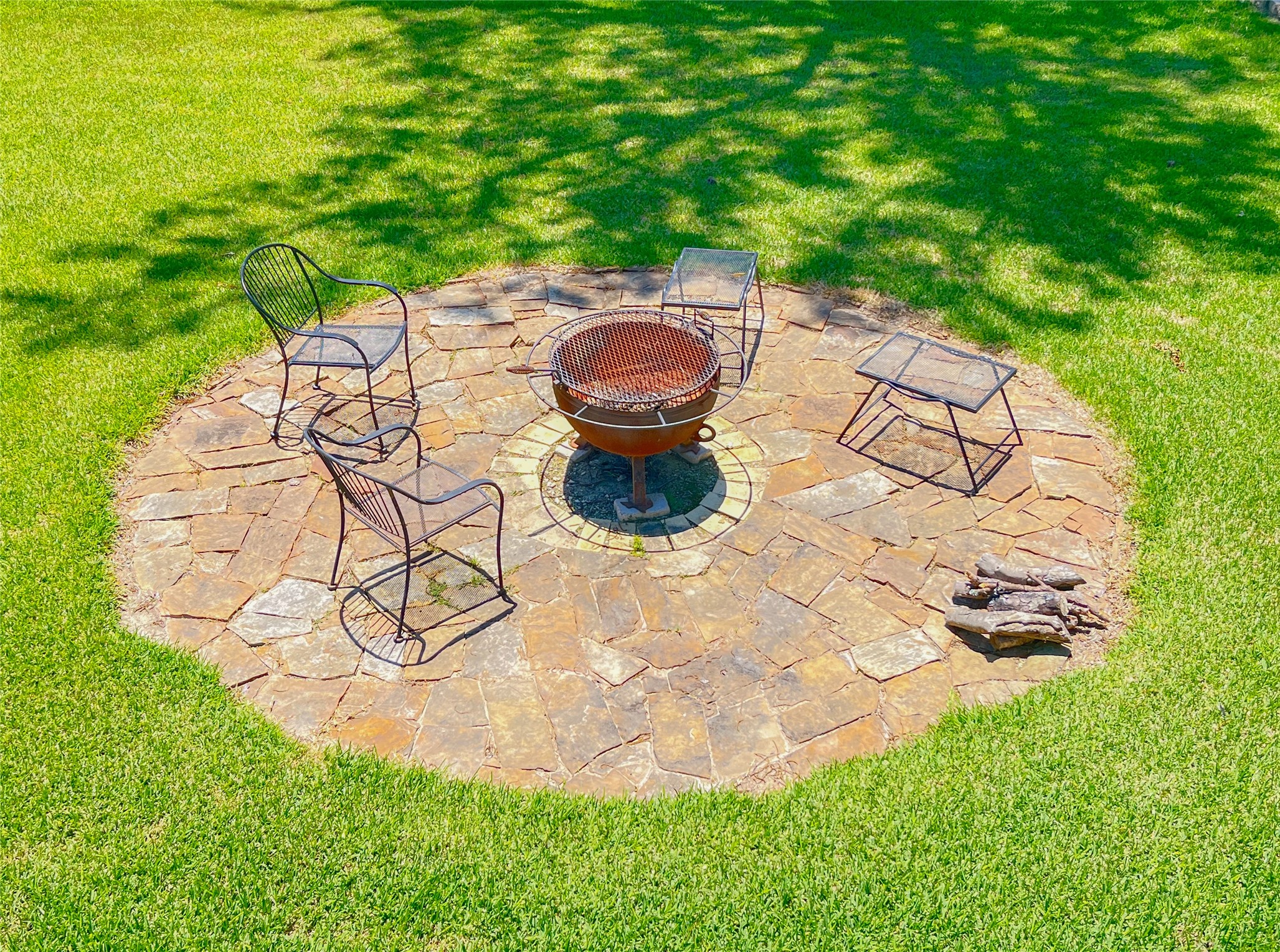 231 Memphis Belle Trinity, TX 75862 - Photo 12 of 47 a backyard of a house with table and chairs