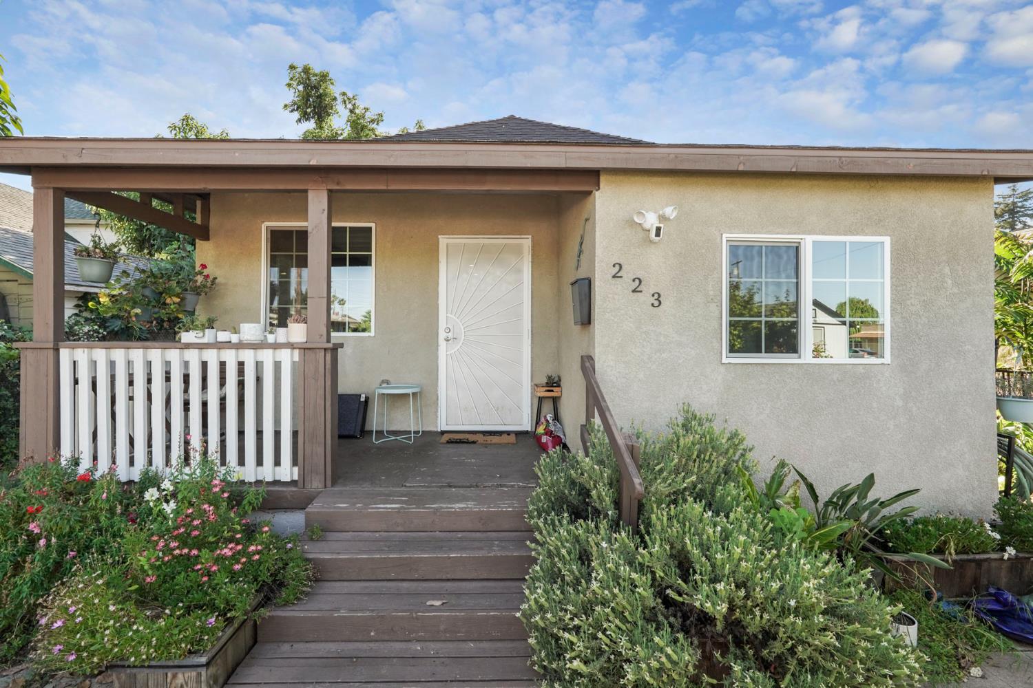 223 Rush Street Lodi, CA 95240 - Photo 1 of 21 a front view of a house with a yard