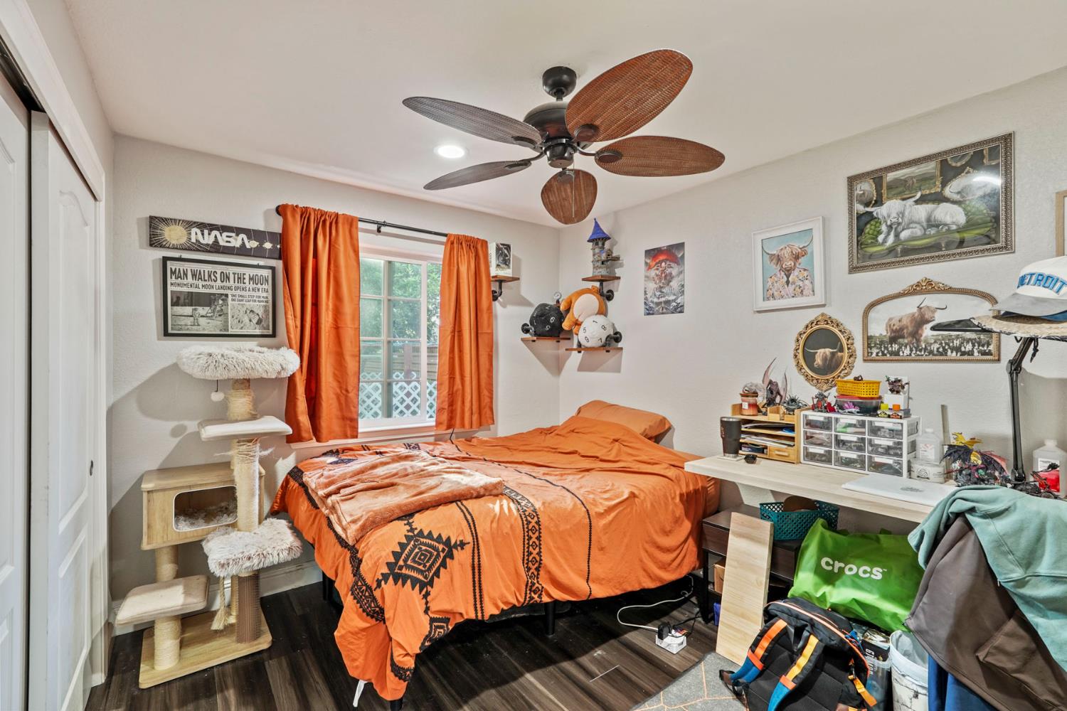 223 Rush Street Lodi, CA 95240 - Photo 12 of 21 a bedroom with a bed and a chandelier