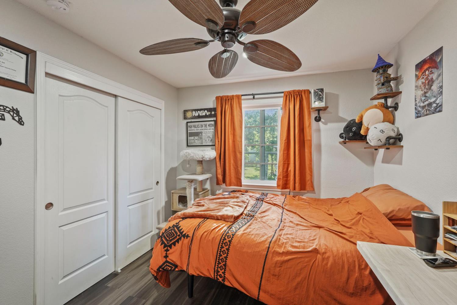 223 Rush Street Lodi, CA 95240 - Photo 13 of 21 a bedroom with a bed and a chandelier