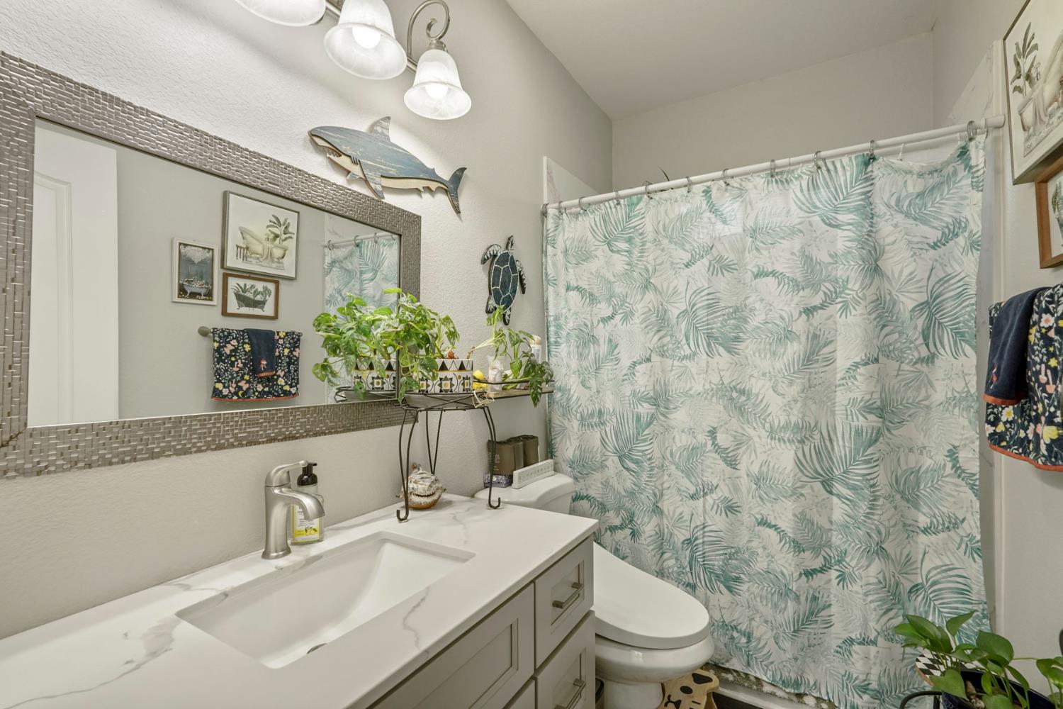 223 Rush Street Lodi, CA 95240 - Photo 16 of 21 a bathroom with a sink toilet and shower