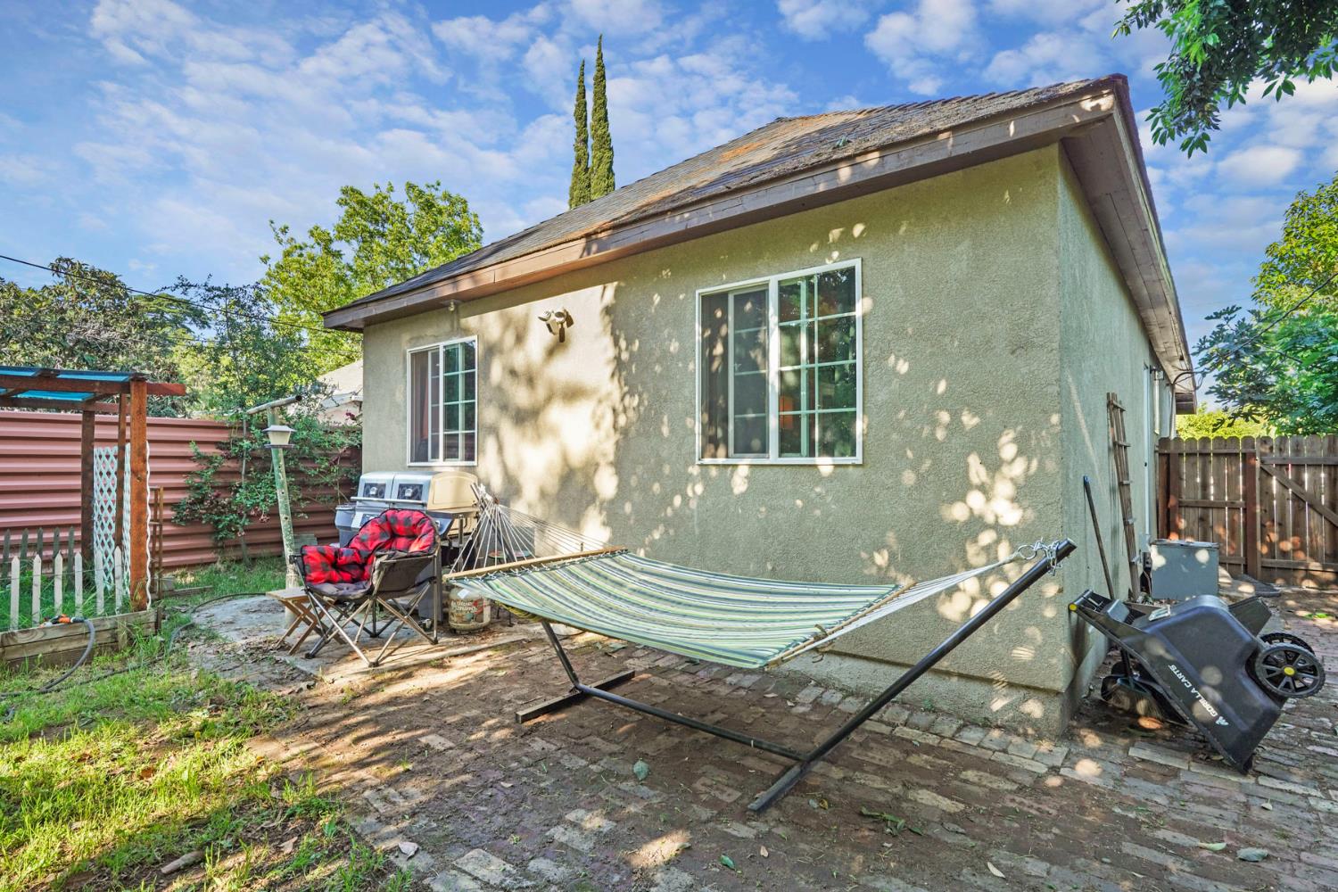 223 Rush Street Lodi, CA 95240 - Photo 20 of 21 a view of a backyard with sitting area and furniture