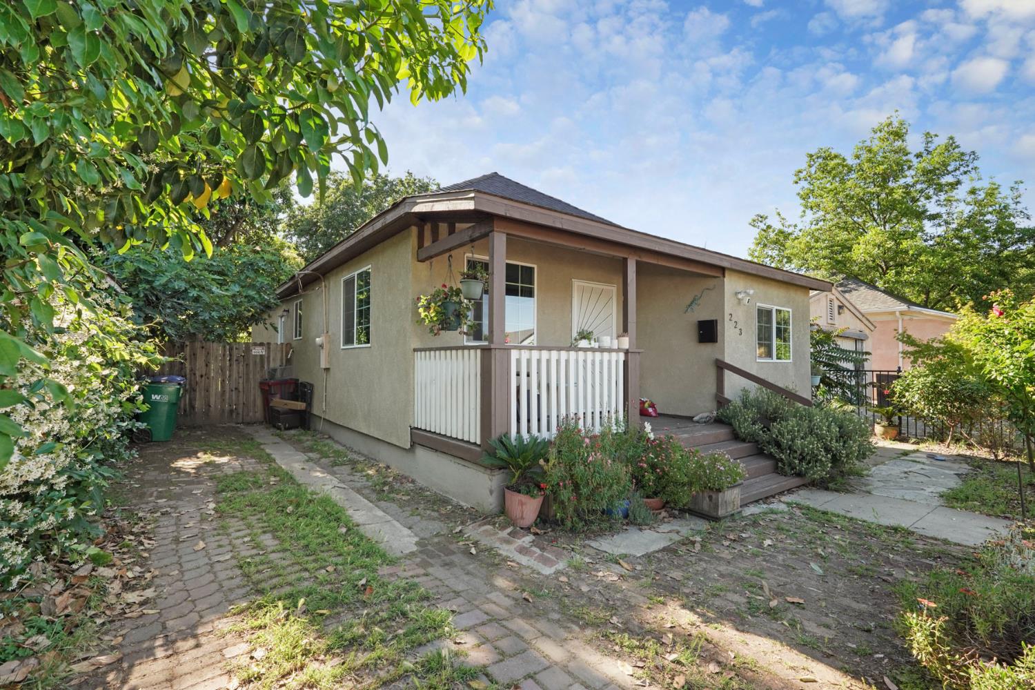 223 Rush Street Lodi, CA 95240 - Photo 3 of 21 a front view of a house with garden