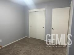 Undisclosed Address Bakersfield, CA 93309 - Photo 18 of 29 a view of a room with wooden floor