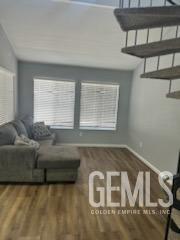 Undisclosed Address Bakersfield, CA 93309 - Photo 2 of 29 a living room with furniture and a window