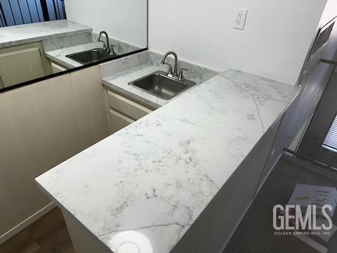 Undisclosed Address Bakersfield, CA 93309 - Photo 22 of 29 a kitchen with a sink and a refrigerator