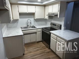 Undisclosed Address Bakersfield, CA 93309 - Photo 7 of 29 a kitchen with stainless steel appliances granite countertop a sink stove a refrigerator and cabinets