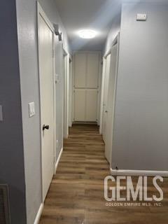 Undisclosed Address Bakersfield, CA 93309 - Photo 8 of 29 a view of a hallway with wooden floor and staircase