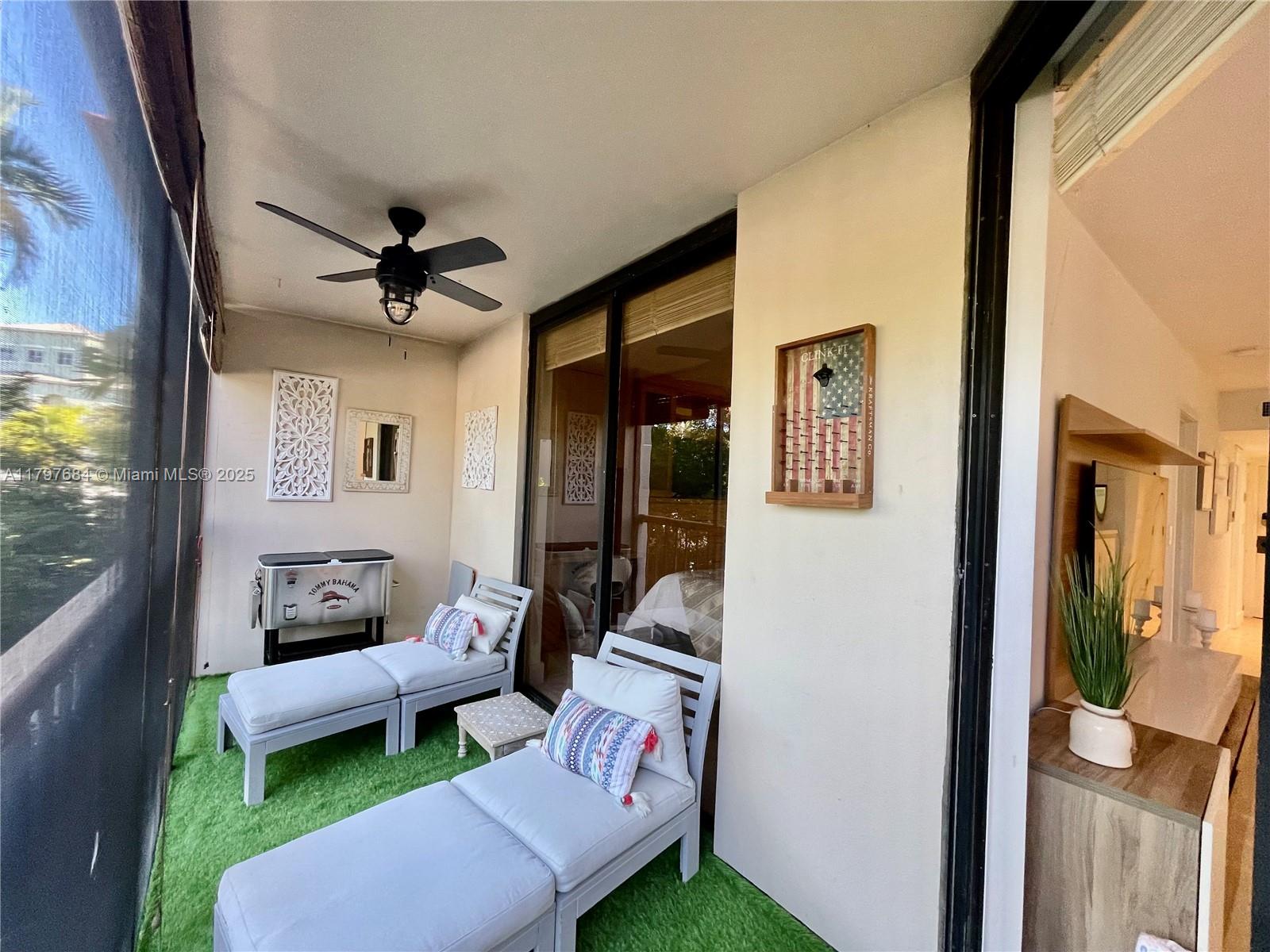 55 Ocean Ln Drive, Unit 2030 Key Biscayne, FL 33149 - Photo 14 of 19 a living room with furniture and a large window